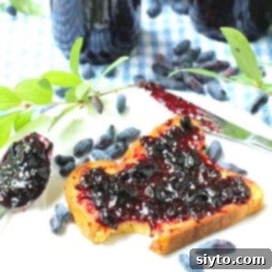 Homemade Haskap Honeyberry Jam Without Pectin 13 A charming thumbnail image depicting haskap jam generously spread on toast, inviting and delicious.