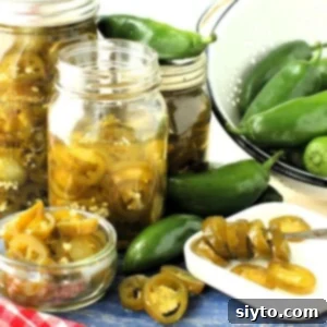Thumbnail of candied jalapenos and fresh ones, illustrating the recipe.