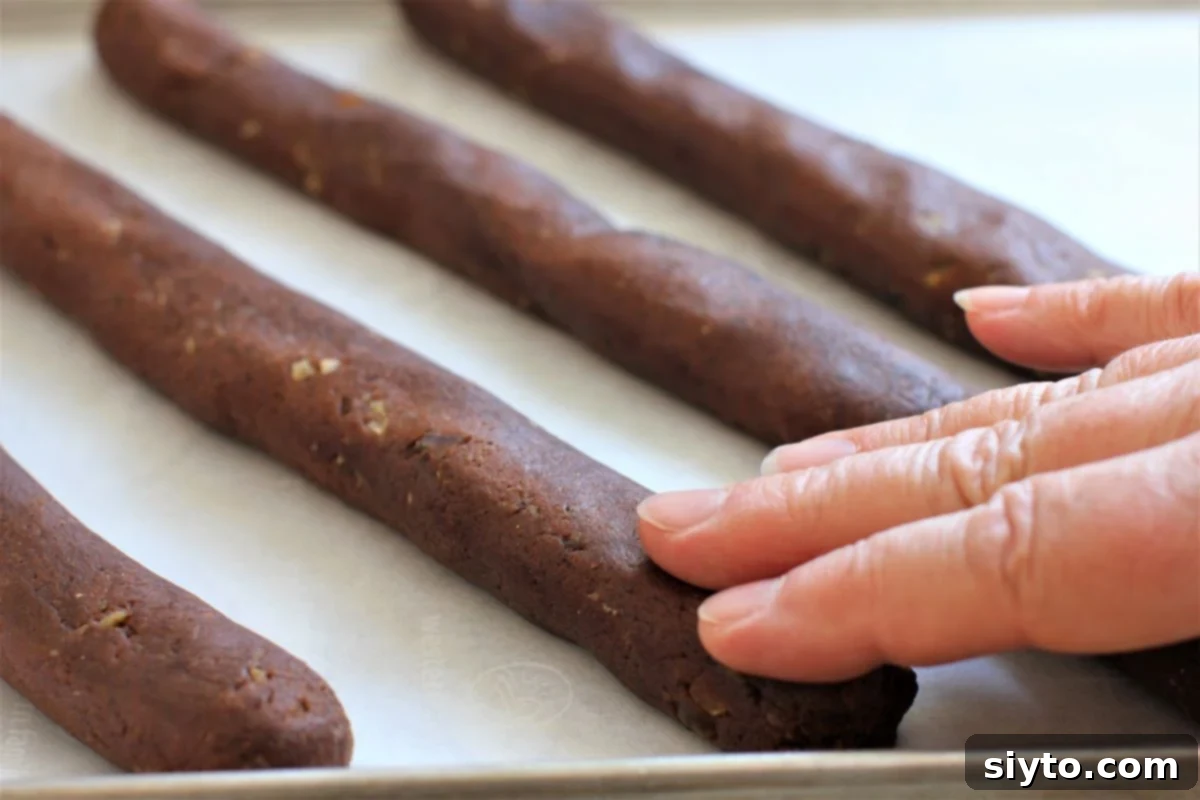 pressing down the strips of dough with fingertips.