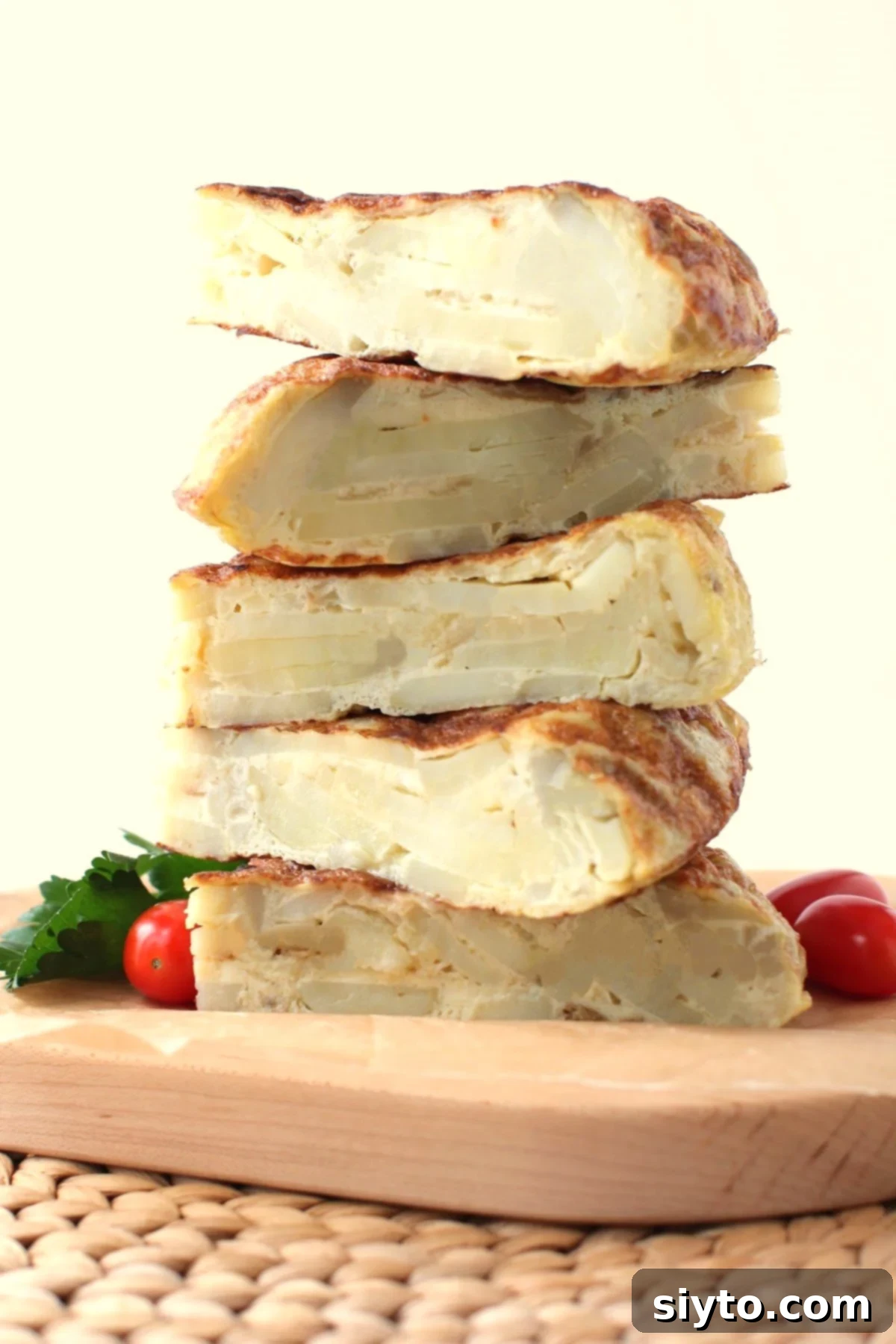 stack of 5 tortilla wedges on a cutting board.