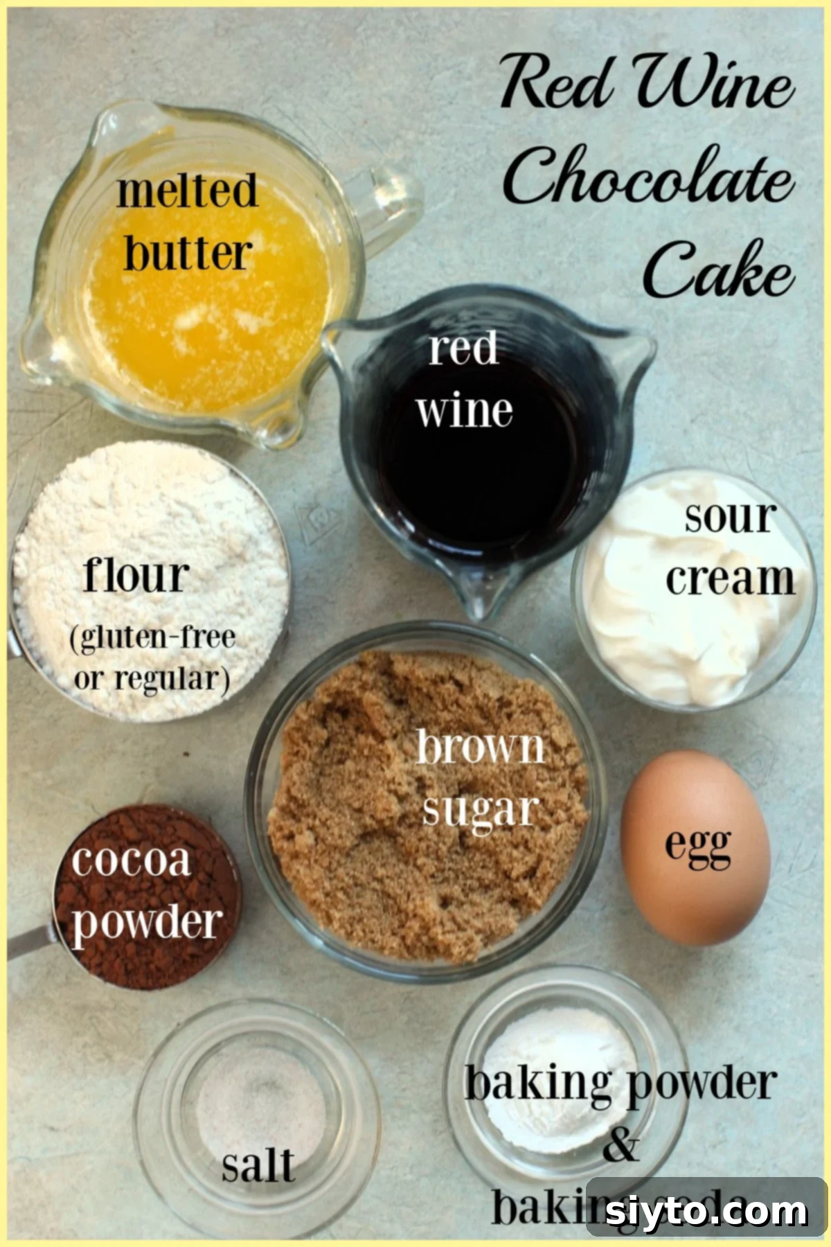 Common ingredients for the Red Wine Chocolate Cake batter, including butter, red wine, sugar, sour cream, egg, flour, cocoa, baking soda, baking powder, and salt.