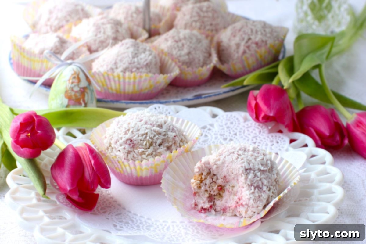 Raspberry Snowballs 11 2 Raspberry Snowballs on a plate, with pink tulips laid beside.