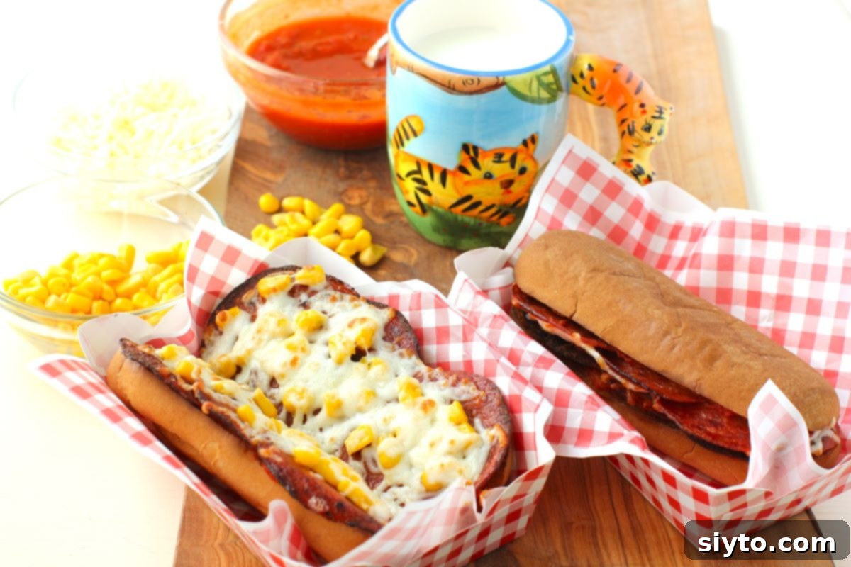 A delicious pizza dog lunch setting, with one corn pizza dog and one plain pizza dog, both served in red checked paper napkins with a kids' cup in the background.