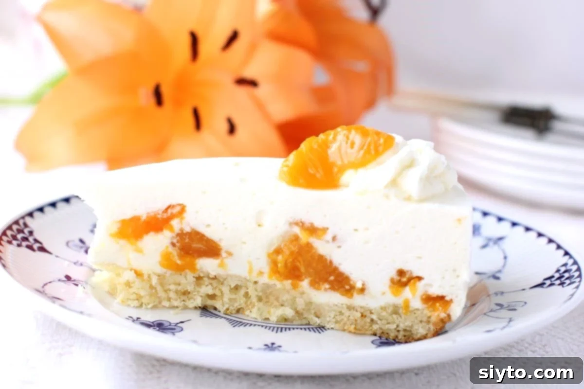 Luscious Mandarin Cream Torte 5 A tantalizing slice of Mandarinen Sahnetorte (German Mandarin Cream Torte) served elegantly on a plate. In the blurred background, an orange lily blossom subtly complements the vibrant citrus hues of the torte, emphasizing its fresh and delightful character.