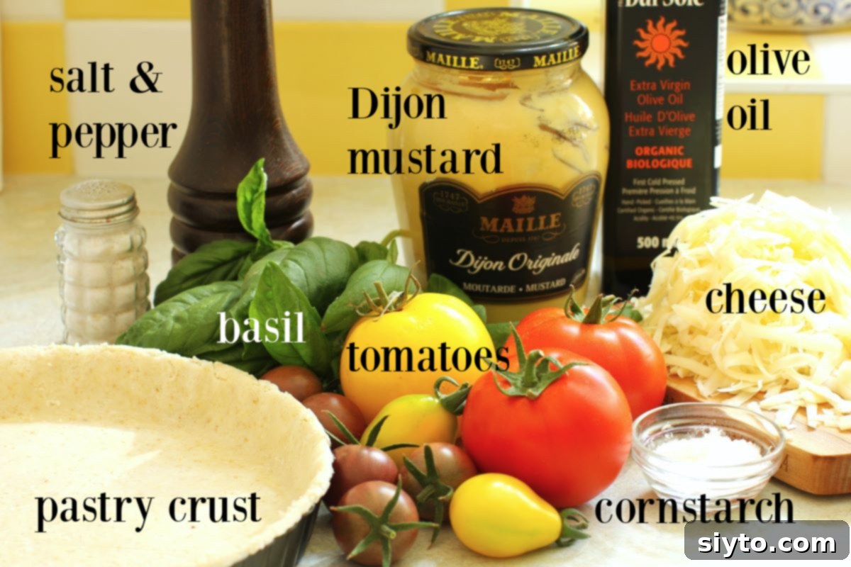 Rustic Tomato Tart 6 Various ingredients for a tomato tart, including fresh tomatoes, cheese, basil, and a tart shell, neatly arranged on a kitchen counter.