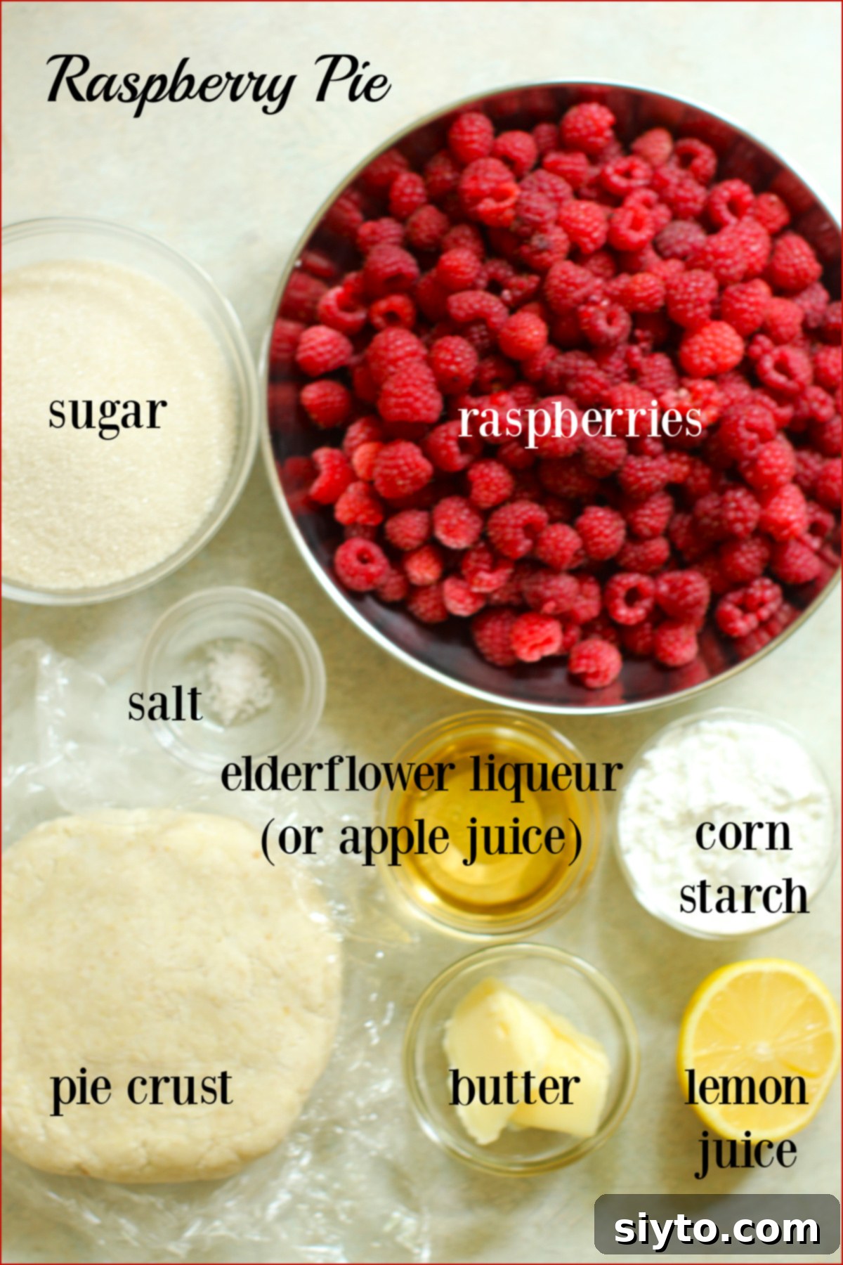 ingredients for a raspberry pie, labeled, including fresh raspberries and elderflower liqueur.