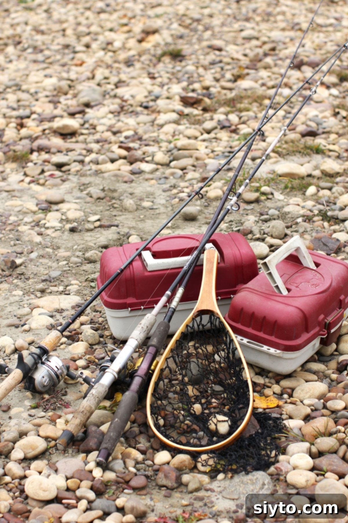 Fishing tackle on the river rocks.