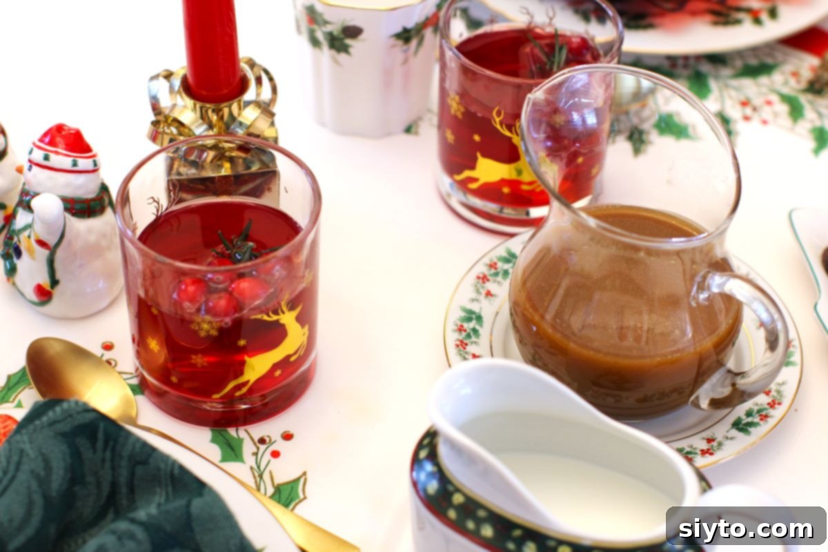 A jug of luscious caramel sauce and a glass of vibrant punch elegantly arranged on the festive brunch table, ready for enjoyment.