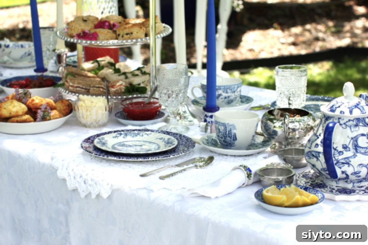 The tea table is set with a mismatched assortment of blue and white china.