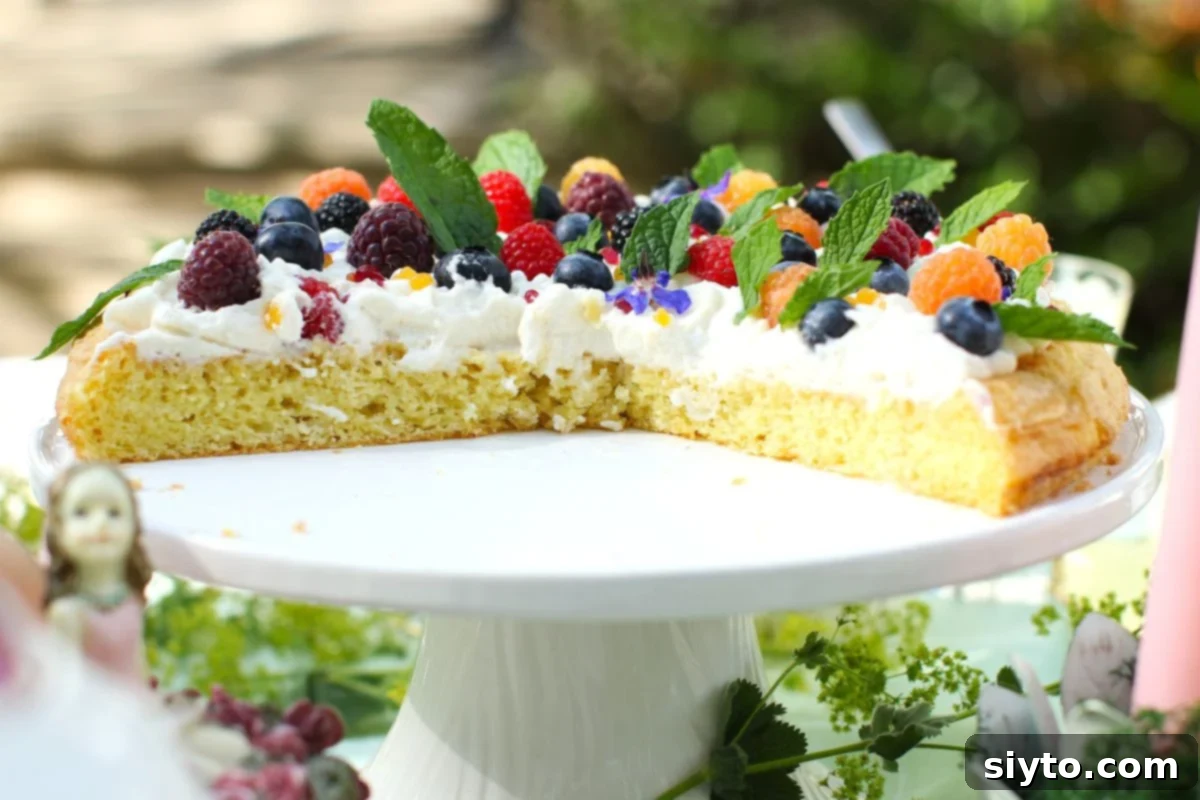 Half of an almond cake left on the cake stand.