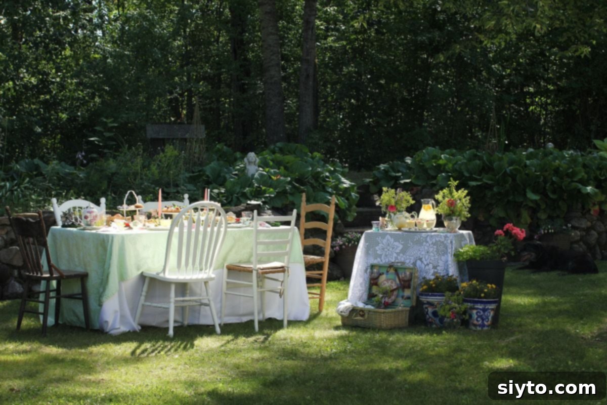 The table set outside against the rock wall for the fairy picnic, with a side table for drinks and desssert.
