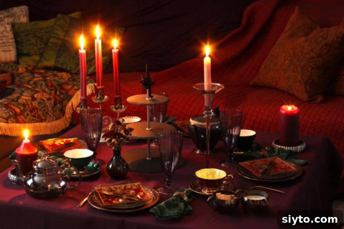 The table is set and candles lit for the moody magic afternoon tea party.