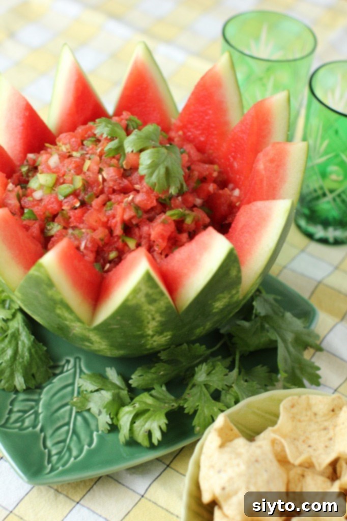 Close-up of fresh watermelon salsa in a decorative carved watermelon bowl, ready to serve