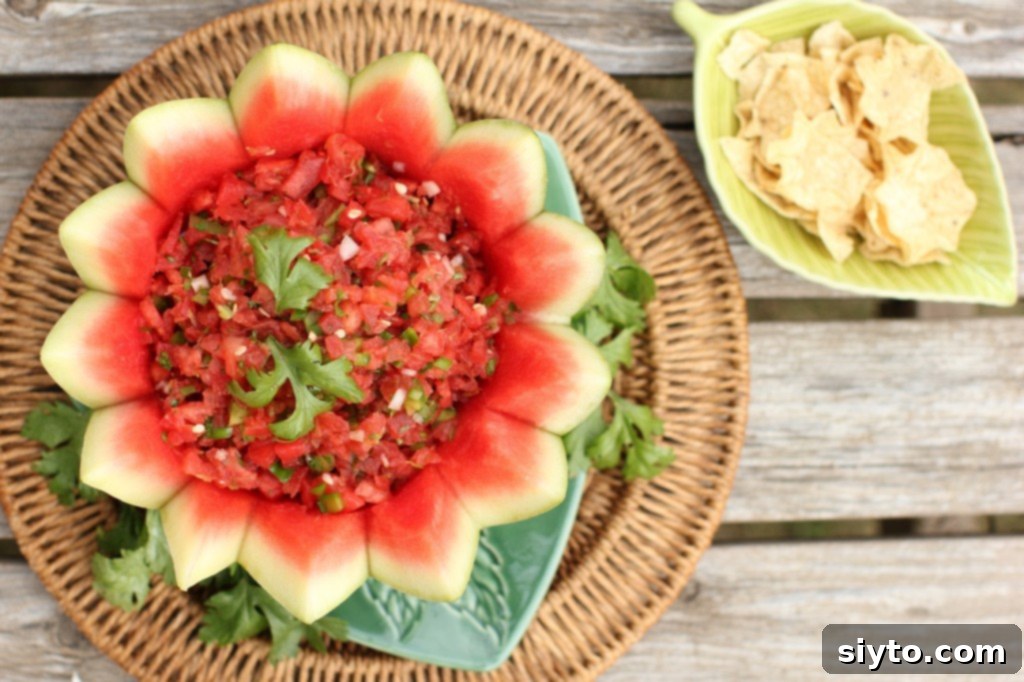 Delicious sweet and spicy watermelon salsa served with crispy taco chips, perfect for dipping