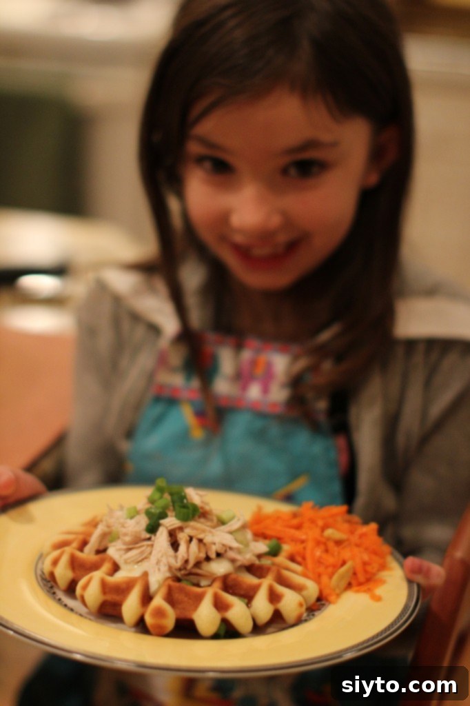 Kids Kitchen Fun: Simple Chicken Waffles & Speedy Carrot Salad 2 A delicious chicken and waffles plate with a side of carrot salad, ready to eat